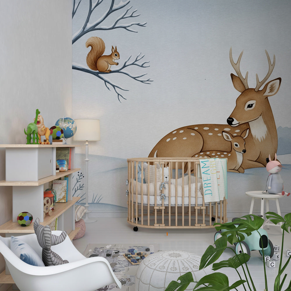 Winter forest wallpaper with deer family in soft blue and beige baby room setting