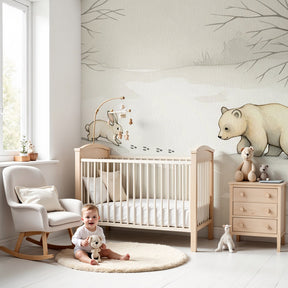 Winter forest animal mural wallpaper in cozy baby nursery with wooden crib by Kids-Mundo