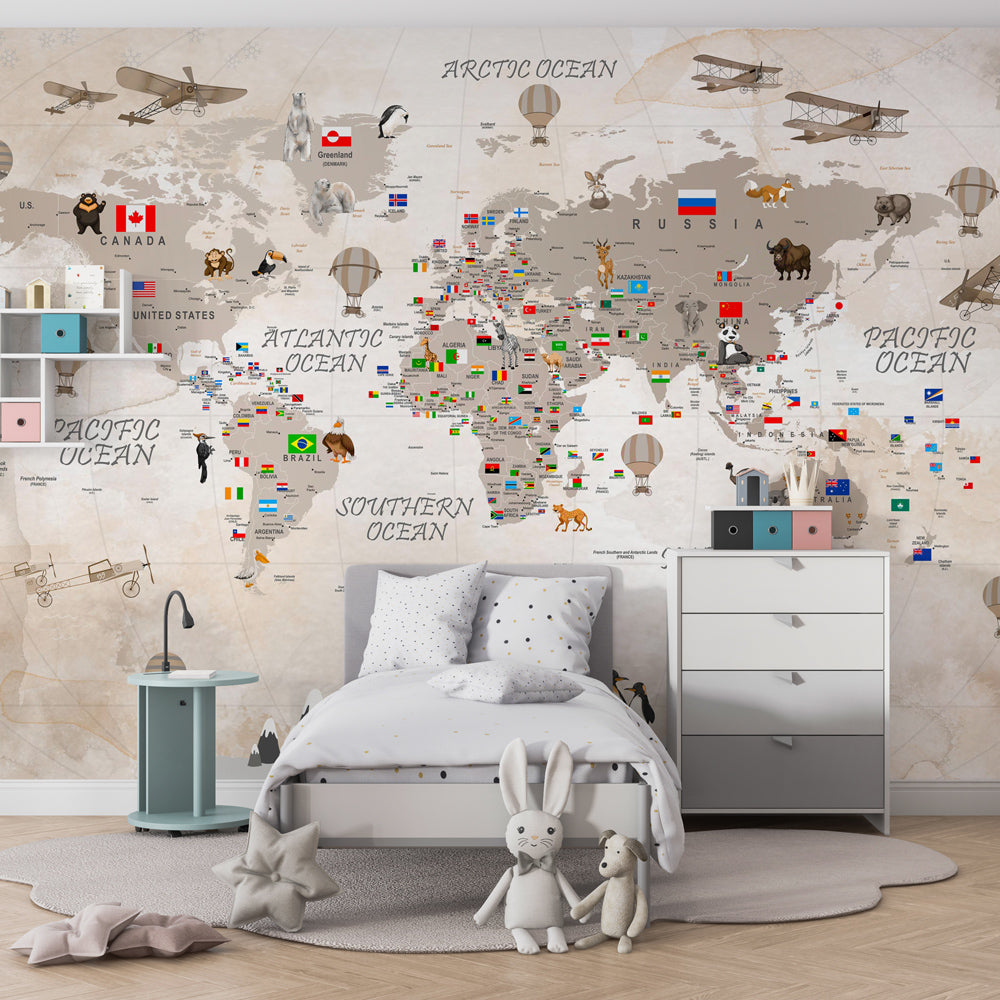 Kids-Mundo world map wall mural with country flags and animals shown in a children's bedroom