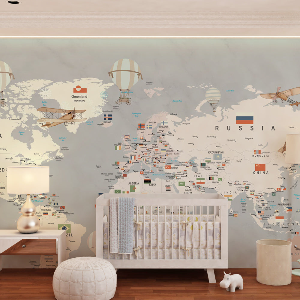 Vintage world map wallpaper featuring planes and flags in children's bedroom decor
