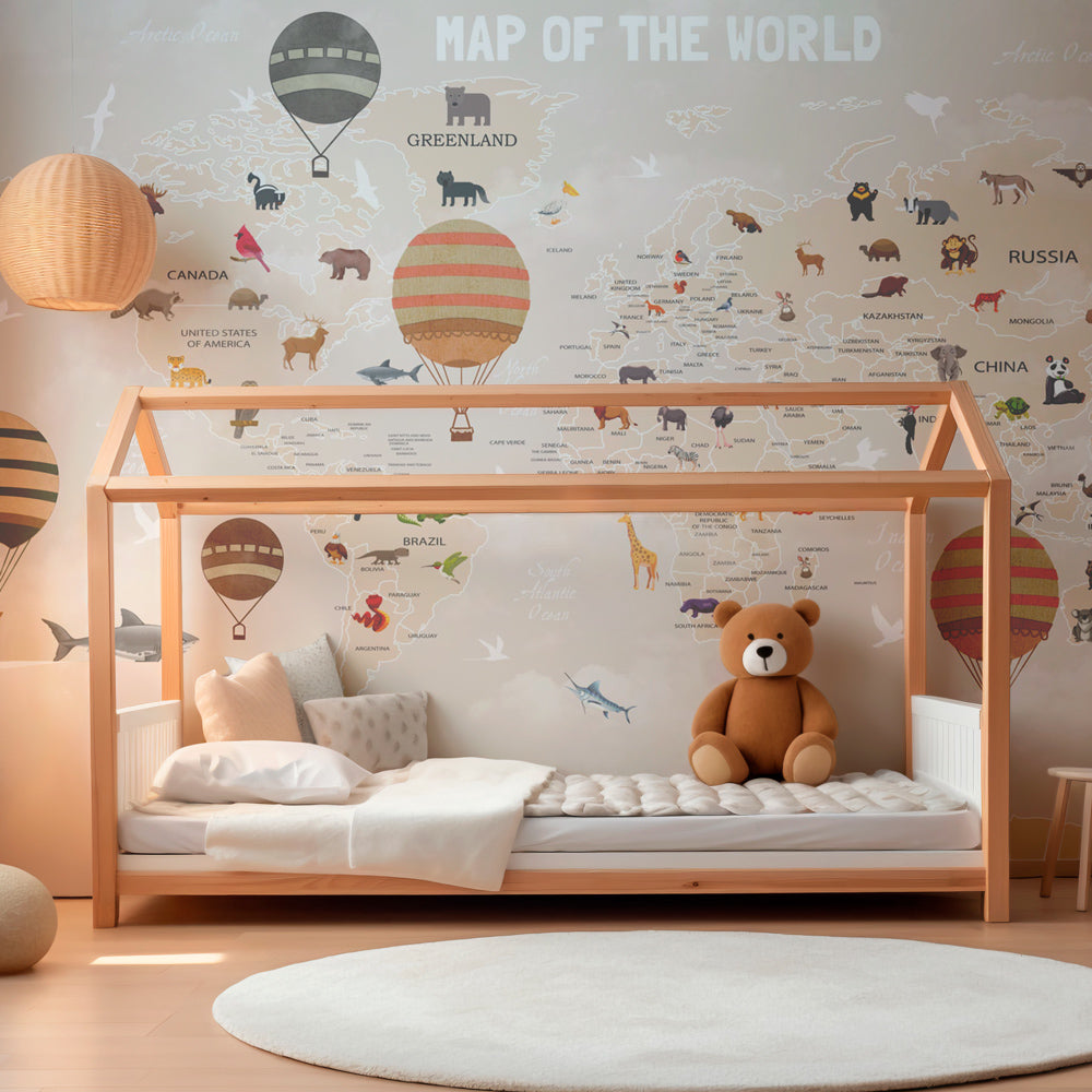 Educational world map mural wallpaper in children's playroom featuring hot air balloons