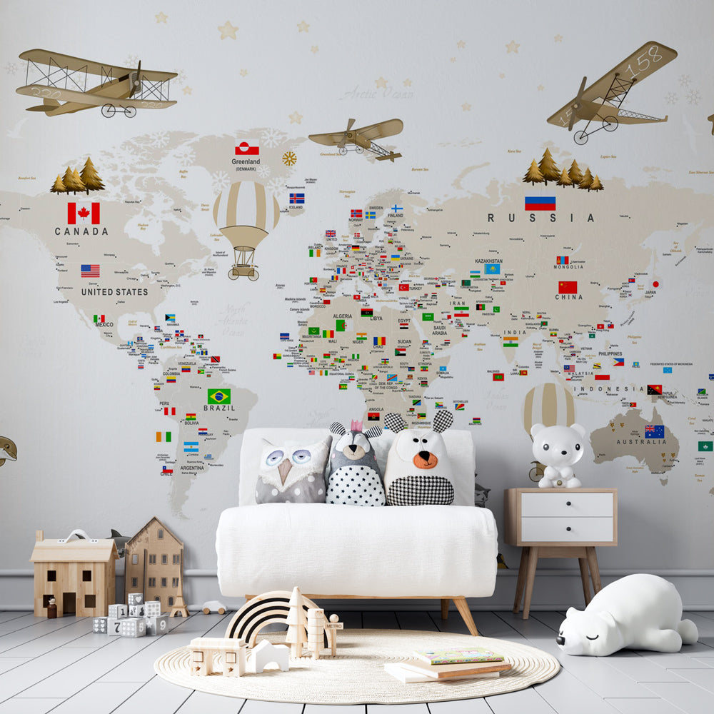 Vintage-style educational map wallpaper transforming children's playroom into adventure space