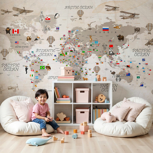 Vintage world map mural wallpaper with animals and hot air balloons in modern nursery by Kids-Mundo